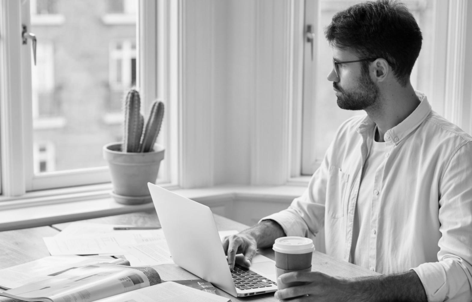 Trader analyzing financial data on computer screen with charts and market indicators
